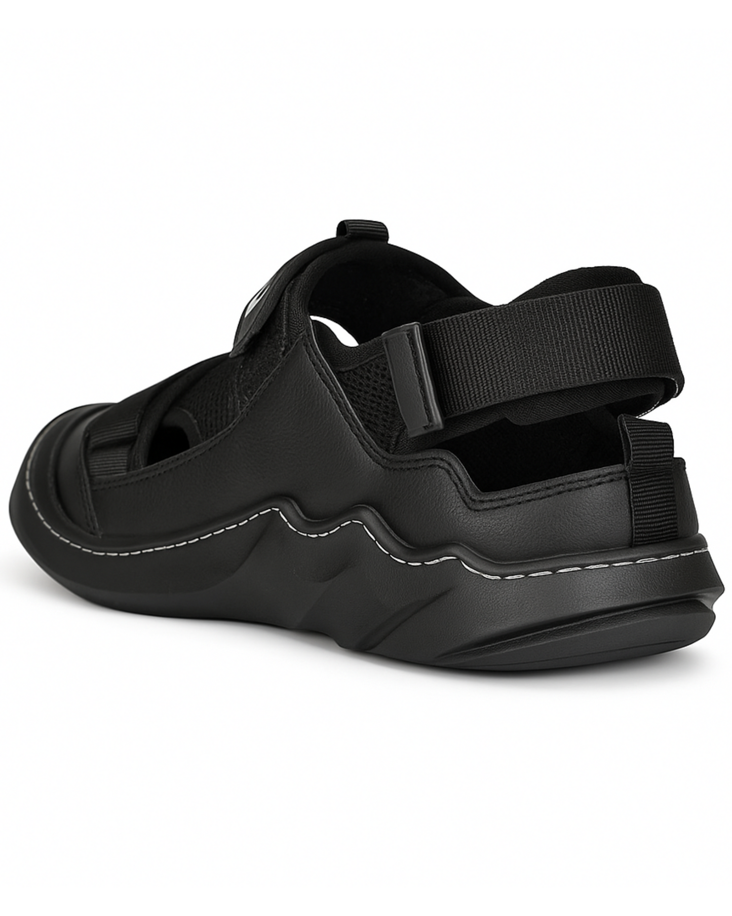 Black sandal with thick sole and adjustable straps on a white background