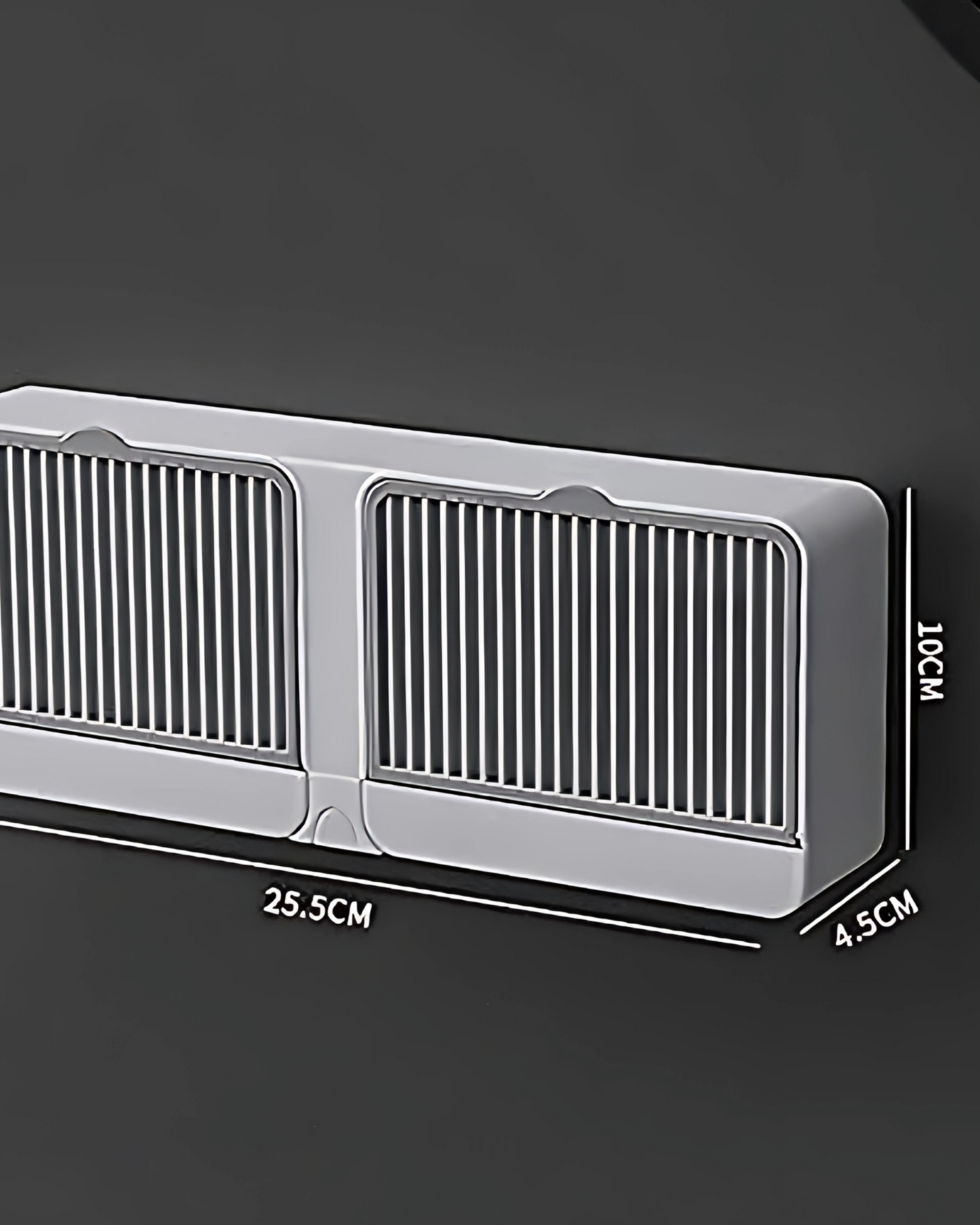 Metallic car grille with dimensions on a dark background