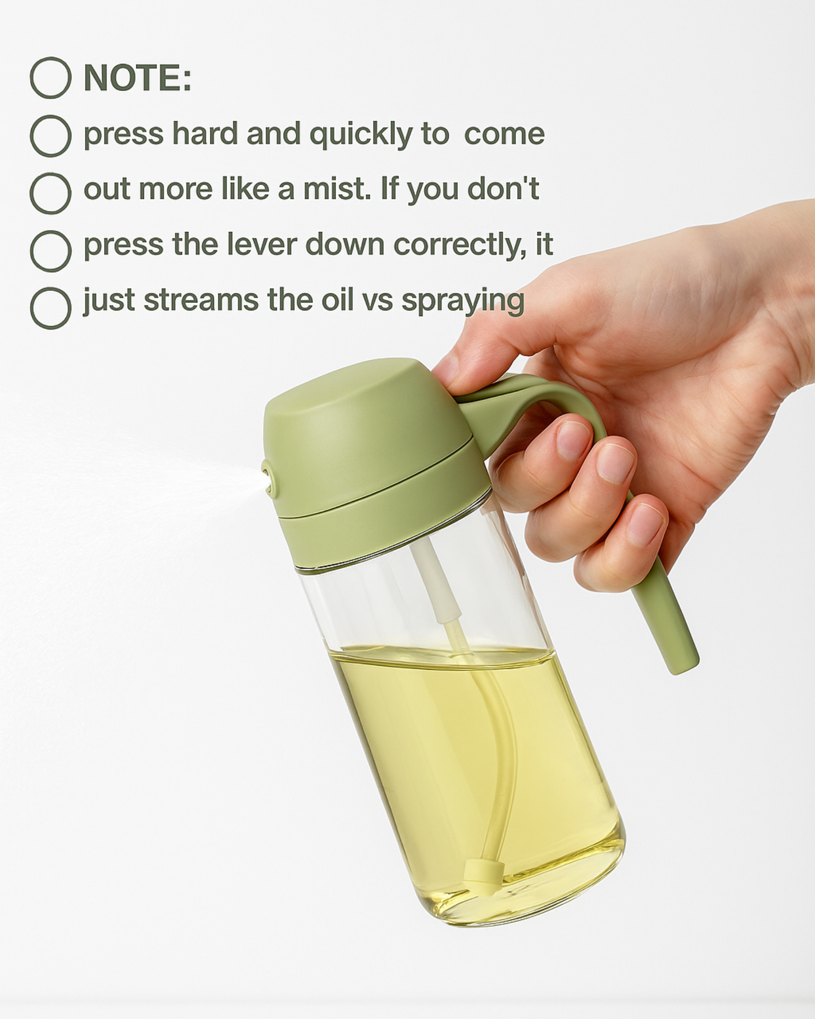 Hand holding a green oil sprayer with usage instructions on a white background.
