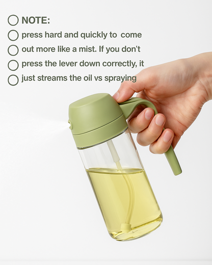 Hand holding a green oil sprayer with usage instructions on a white background.