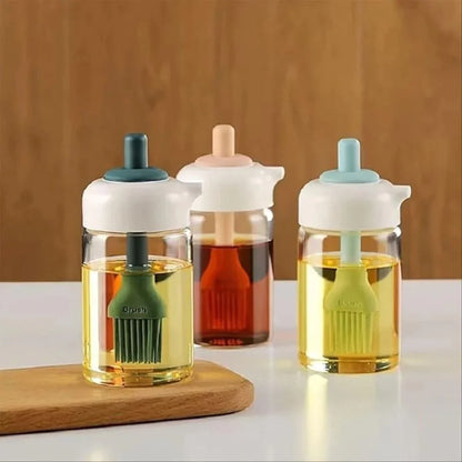 Three glass bottles with colorful caps and brush attachments on a wooden surface.