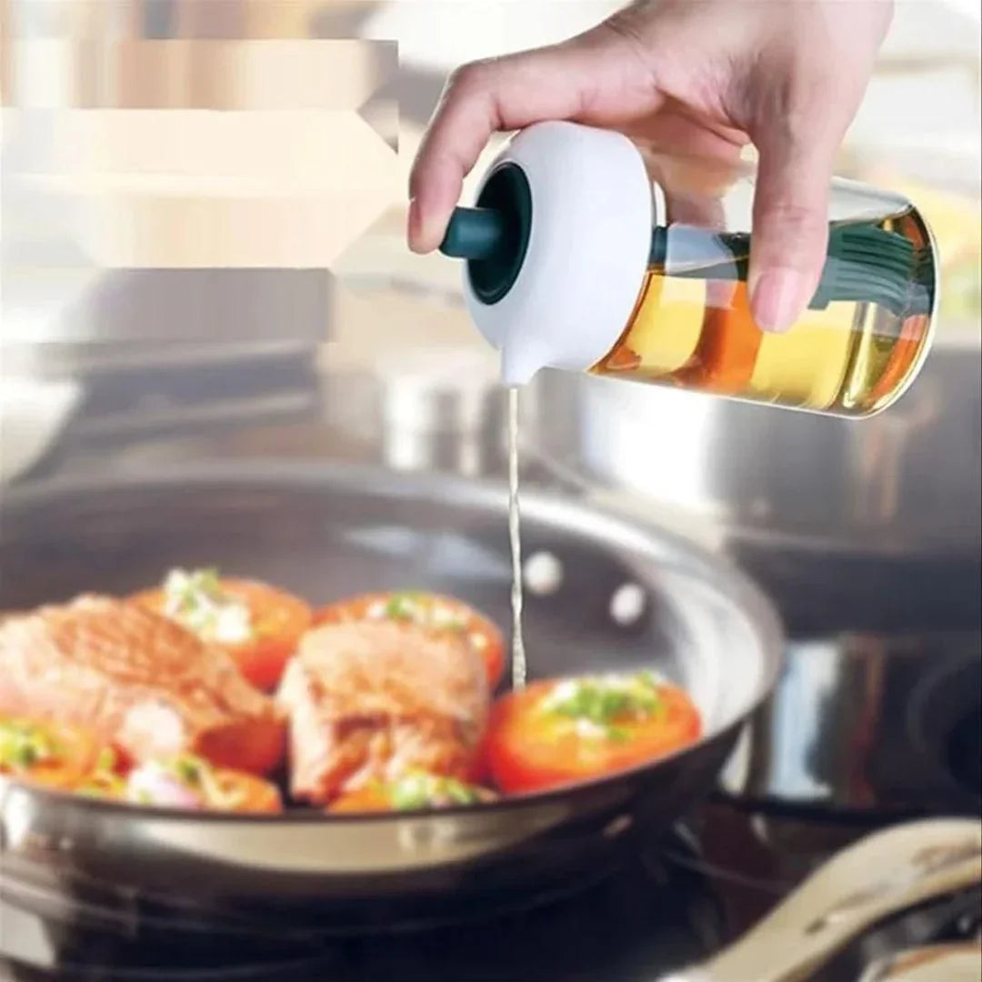 Person pouring oil from a bottle into a frying pan with food on a stove.