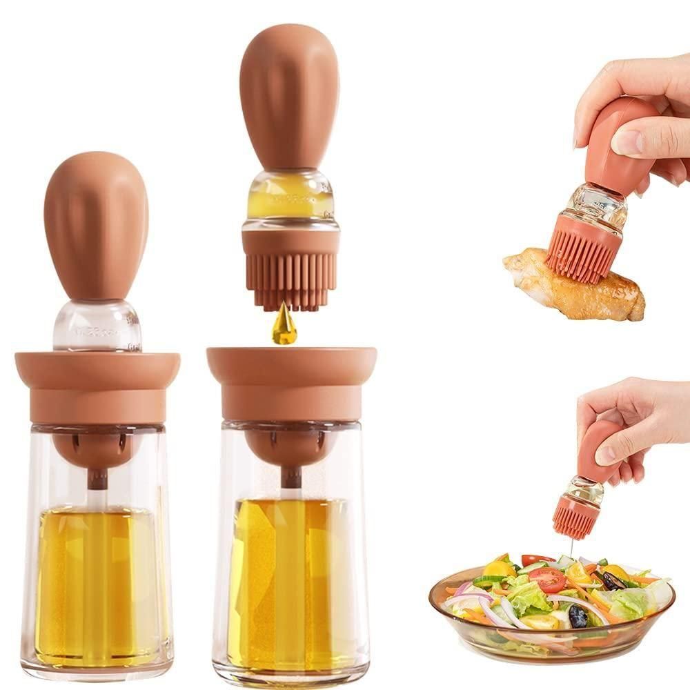 Glass oil dispenser with silicone nozzles being used on a salad.