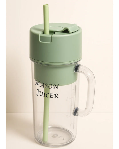 Mason Juicer with green lid and straw on a beige background