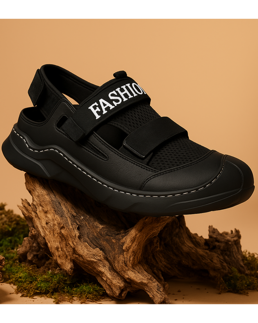 Black sandal with 'FASHION' strap on a wooden stump against a beige background