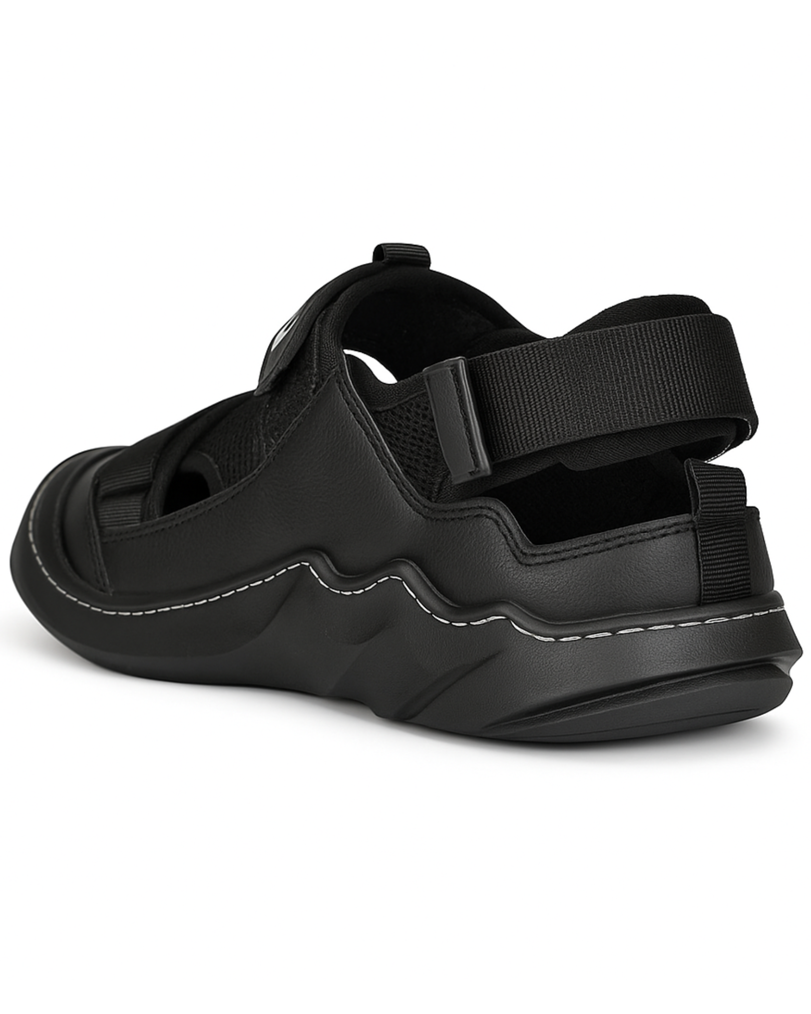 Black sandal with thick sole and adjustable straps on a white background