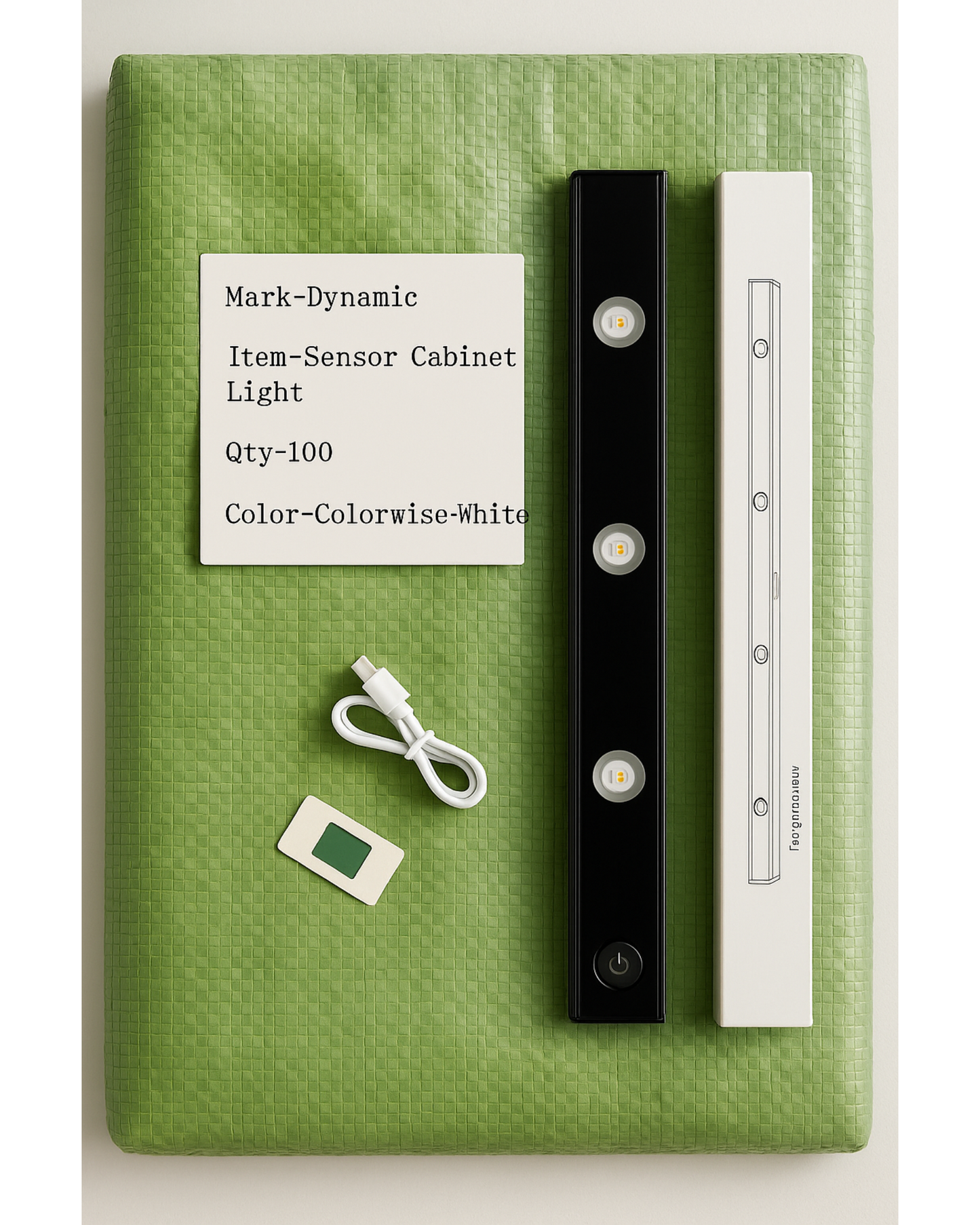 Sensor cabinet light with packaging on a green surface