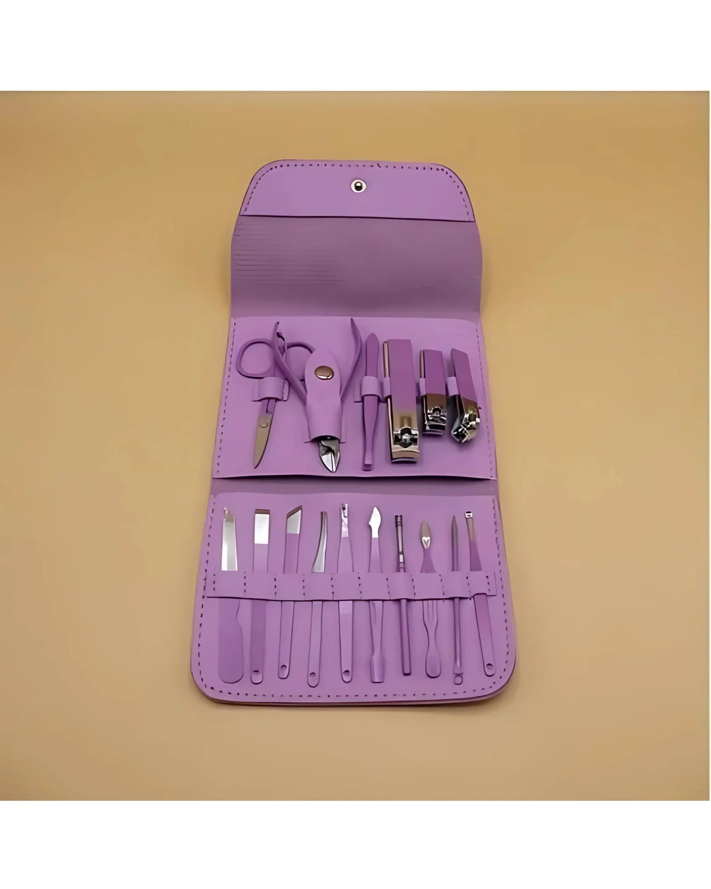 Purple manicure set with tools on a beige background