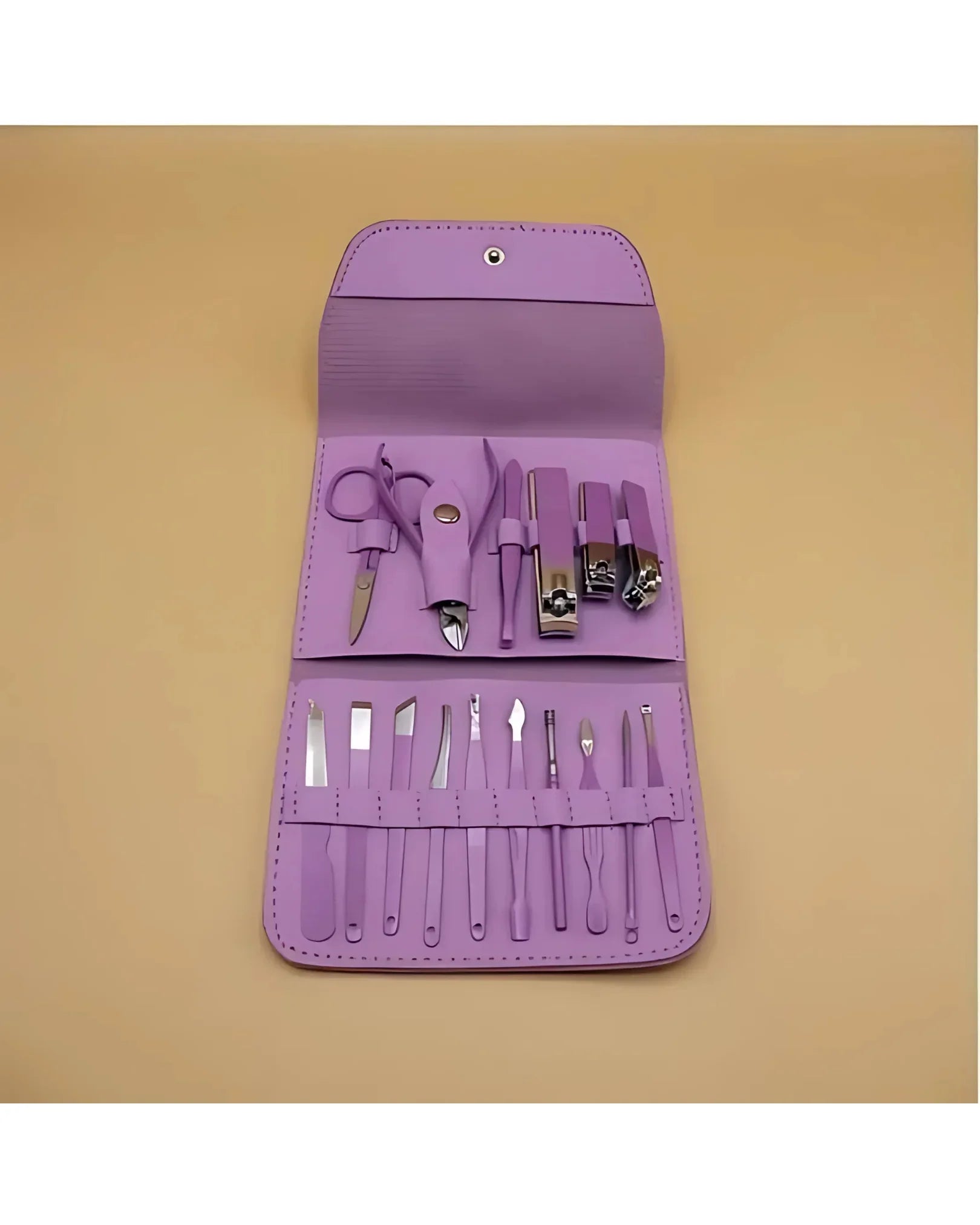 Purple manicure set with tools on a beige background