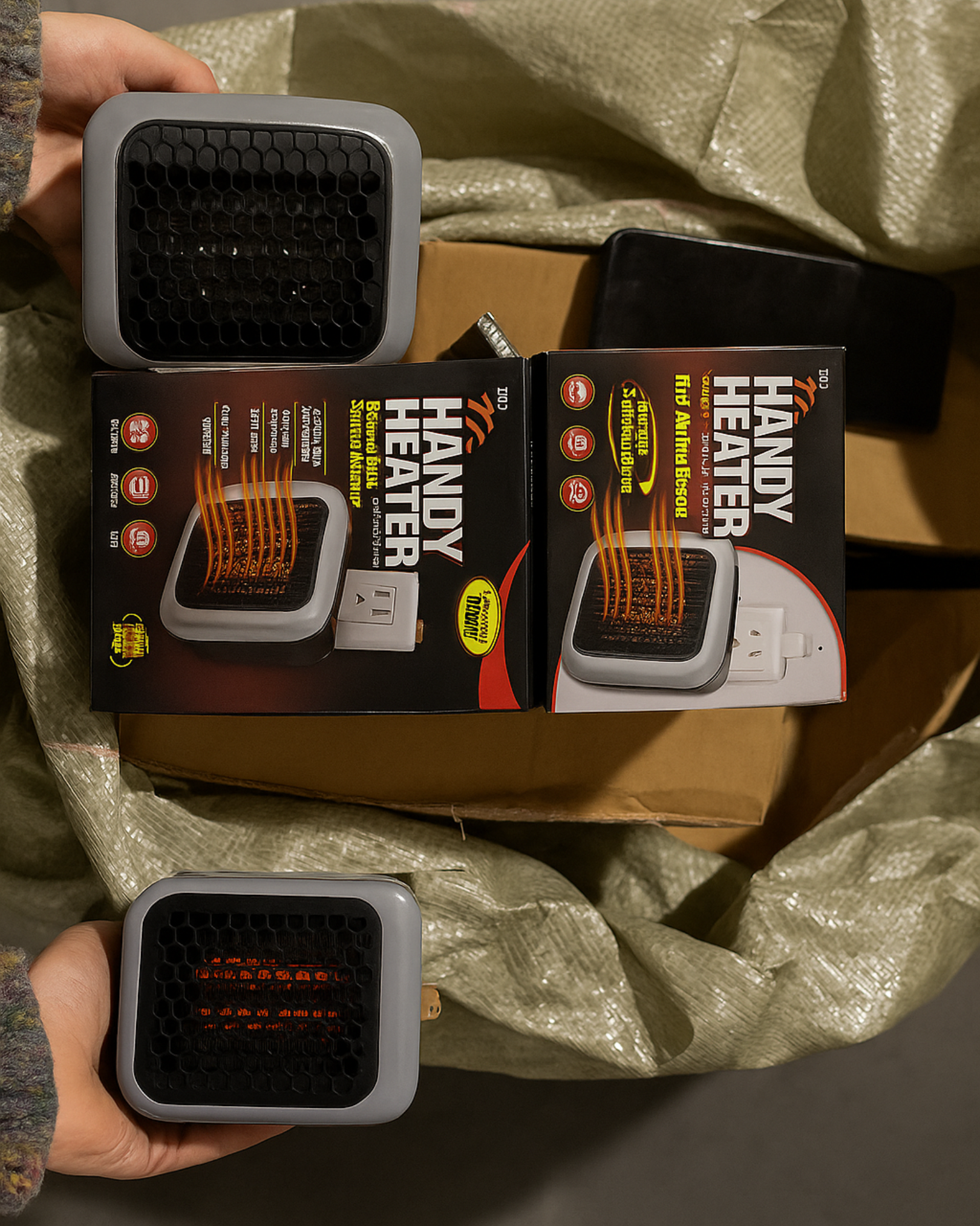 Handy Heater with packaging on a cardboard surface
