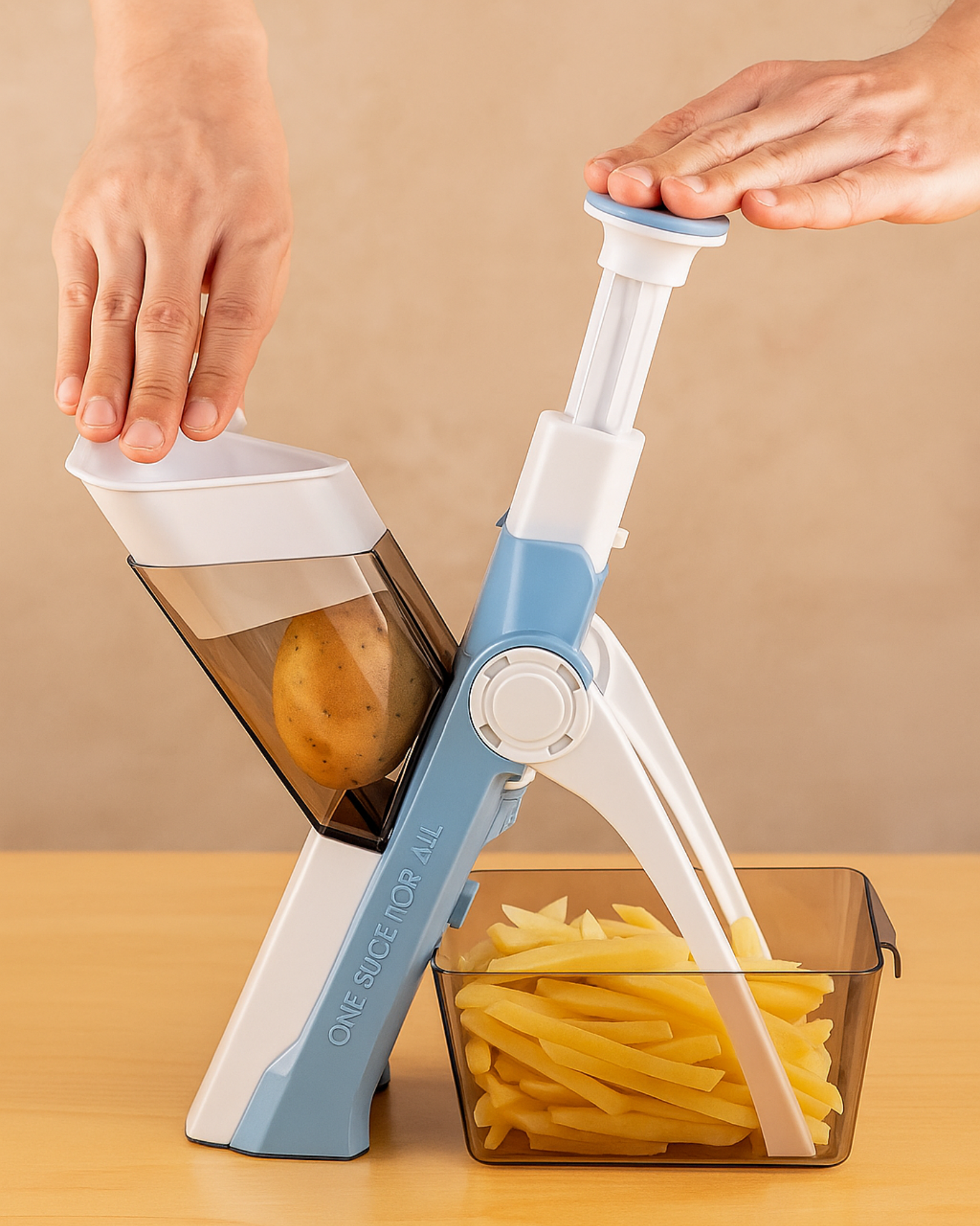 Handheld vegetable spiralizer with a clear container filled with spiralized vegetables on a beige background