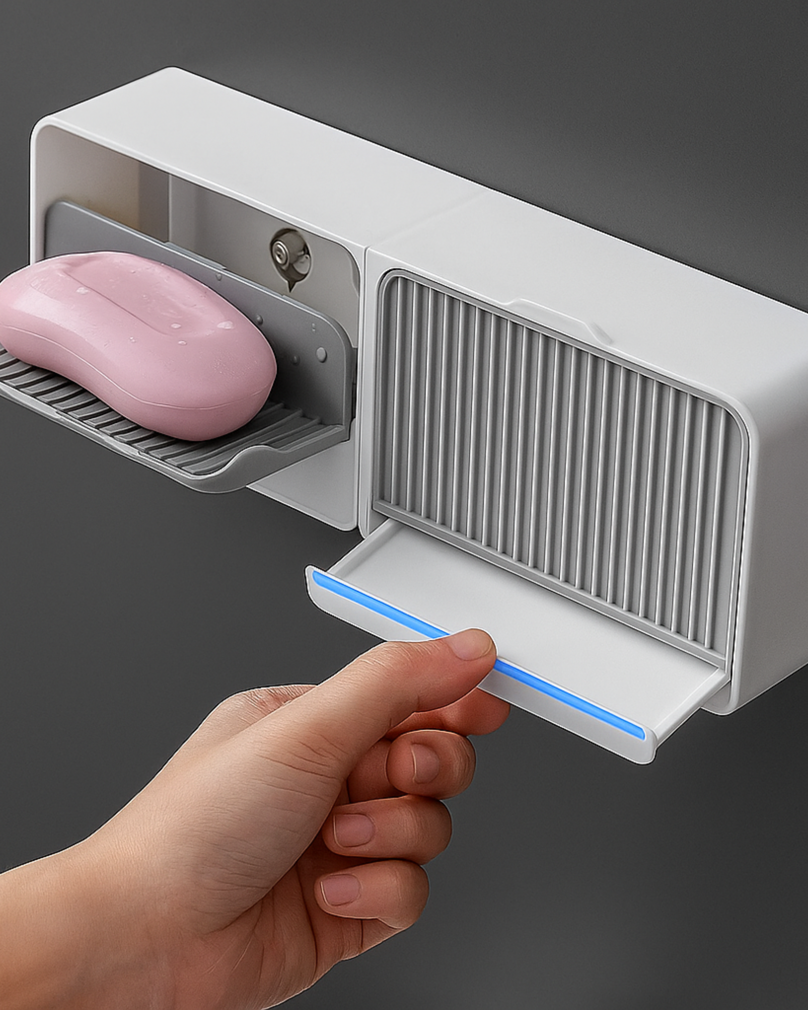 Hand holding a soap bar above a white soap dispenser with a gray background