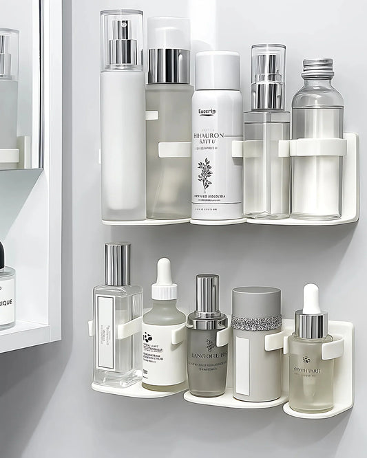 Set of skincare products on a white shelf against a light gray wall.